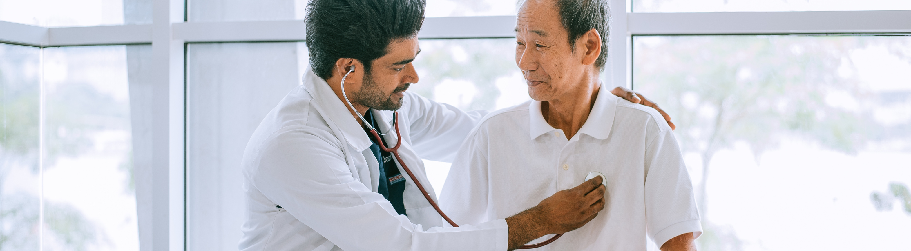 Older adult getting examination from doctor